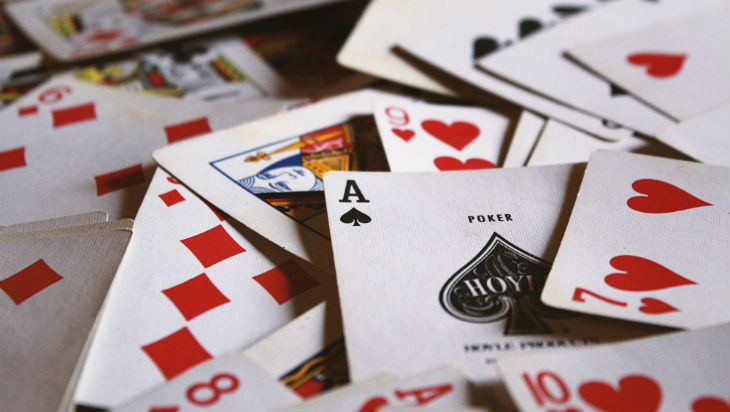 Playing cards scattered across a surface