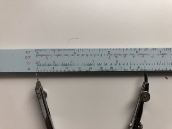 Figure 3: Pair of compasses spread between 1 and 2 on a logarithmic scale.