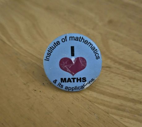 A worn out I heart maths badge